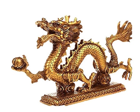 golden dragon statue - symbol for money andd luck in the year of the dog 2018
